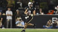 Vanderbilt Commodores quarterback Diego Pavia (2) scrambles against the Auburn Tigers during the second half at FirstBank Stadium.