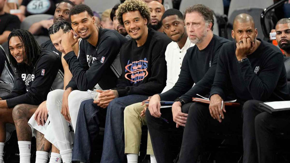 San Antonio Spurs forwards Victor Wembanyama (1) and Jeremy Sochan (10) share laughs during the second half against the Utah Jazz at Frost Bank Center.