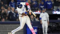 Toronto Blue Jays first baseman Vladimir Guerrero Jr. (27) hits a double against the Los Angeles Dodgers in the eleventh inning during game seven of the 2025 MLB World Series.