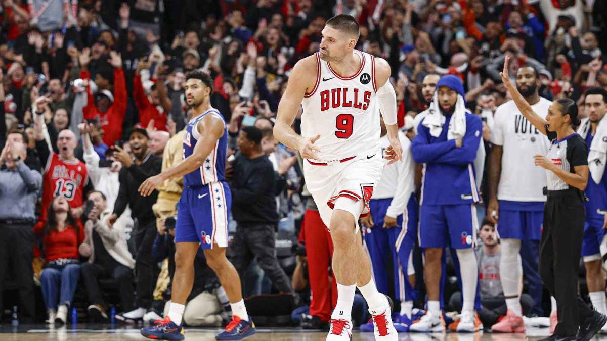 Chicago Bulls center Nikola Vucevic (9) reacts after shooting and scoring a game winning three-pointer against Philadelphia 76ers guard Quentin Grimes (5) during the second half at United Center.