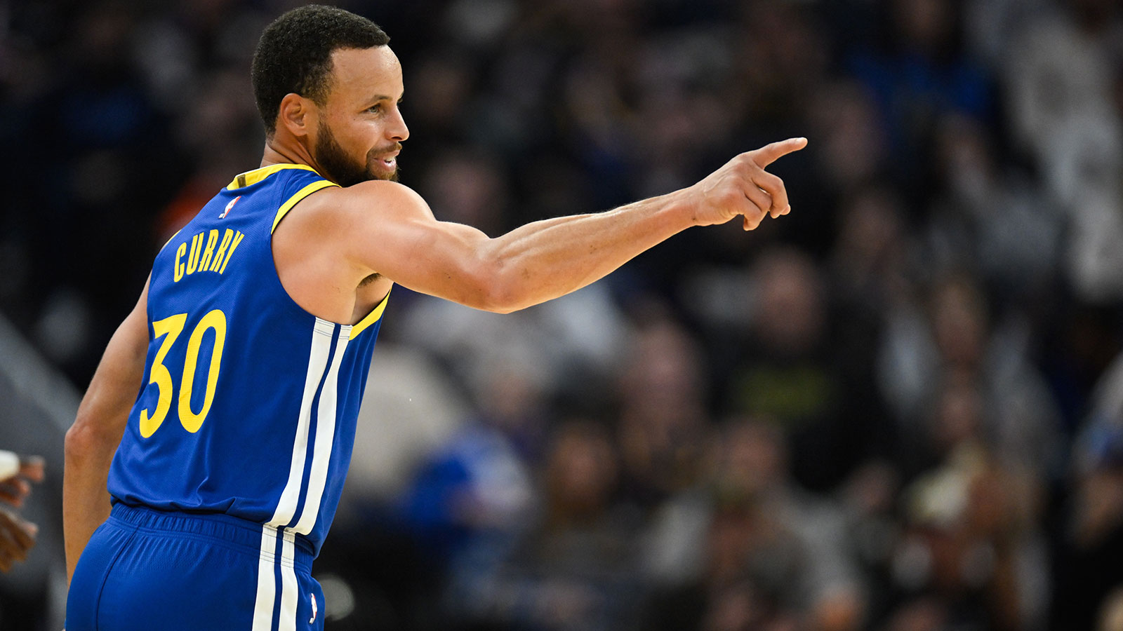 Warriors guard Stephen Curry (30) celebrates a three point basket against the Phoenix Suns in the second quarter at Chase Center