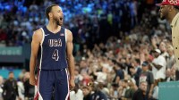 Stephen Curry (4) celebrates with Carmelo Anthony in the second half against France in the men's basketball gold medal game during the Paris 2024 Olympic Summer Games at Accor Arena