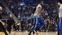 Golden State Warriors forward Jonathan Kuminga (1) warms up before facing the Indiana Pacers at Chase Center.