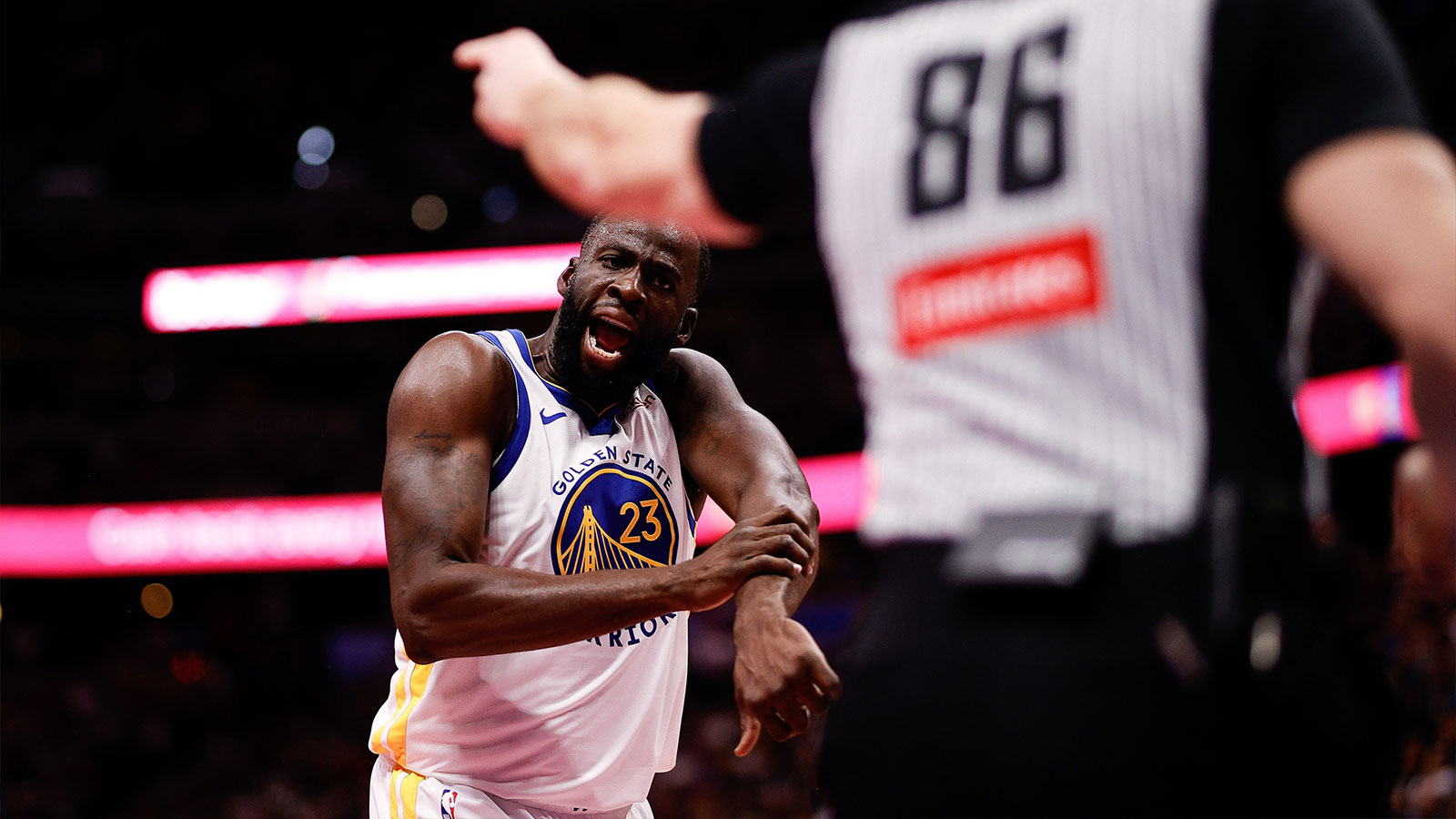 Warriors forward Draymond Green (23) reacts towards referee Brandon Schwab (86) in the third quarter against the Denver Nuggets at Ball Arena