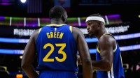 Golden State Warriors forward Jimmy Butler III (10) talks to forward Draymond Green (23) during the first half against the Los Angeles Lakers at Crypto.com Arena.