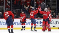 Washington Capitals goaltender Logan Thompson (48) celebrates with Capitals defenseman Trevor van Riemsdyk (57) after their game against the Edmonton Oilers at Capital One Arena.