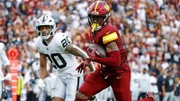 Washington Commanders wide receiver Terry McLaurin (17) runs the ball during the second half as Las Vegas Raiders safety Isaiah Pola-Mao (20) defends at Northwest Stadium.