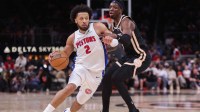 Detroit Pistons guard Cade Cunningham (2) drives on Atlanta Hawks forward Onyeka Okongwu (17) in the second quarter at State Farm Arena.
