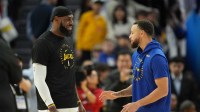 Dec 25, 2024; San Francisco, California, USA; Los Angeles Lakers forward LeBron James (left) talks with Golden State Warriors guard Stephen Curry (right) before the game at Chase Center. Mandatory Credit: Darren Yamashita-Imagn Images