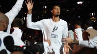 San Antonio Spurs forward Victor Wembanyama (1) enters the court during the start of the game against the Houston Rockets at Frost Bank Center.