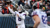 New York Giants quarterback Jaxson Dart (6) throws pass against the Chicago Bears during the second half at Soldier Field.