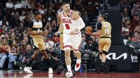 Nov 22, 2025; Chicago, Illinois, USA; Chicago Bulls center Nikola Vucevic (9) reacts after scoring against the Washington Wizards during the second half at United Center. Mandatory Credit: Kamil Krzaczynski-Imagn Images