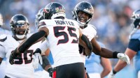 Houston Texans defensive end Will Anderson Jr. (51) celebrates with defensive end Danielle Hunter (55) after his sack of Tennessee Titans quarterback Cameron Ward (1) during the second half at Nissan Stadium.