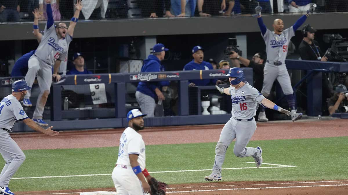 Los Angeles Dodgers catcher Will Smith (16) runs after hitting a home run against the Toronto Blue Jays in the eleventh inning during game seven of the 2025 MLB World Series at Rogers Centre.