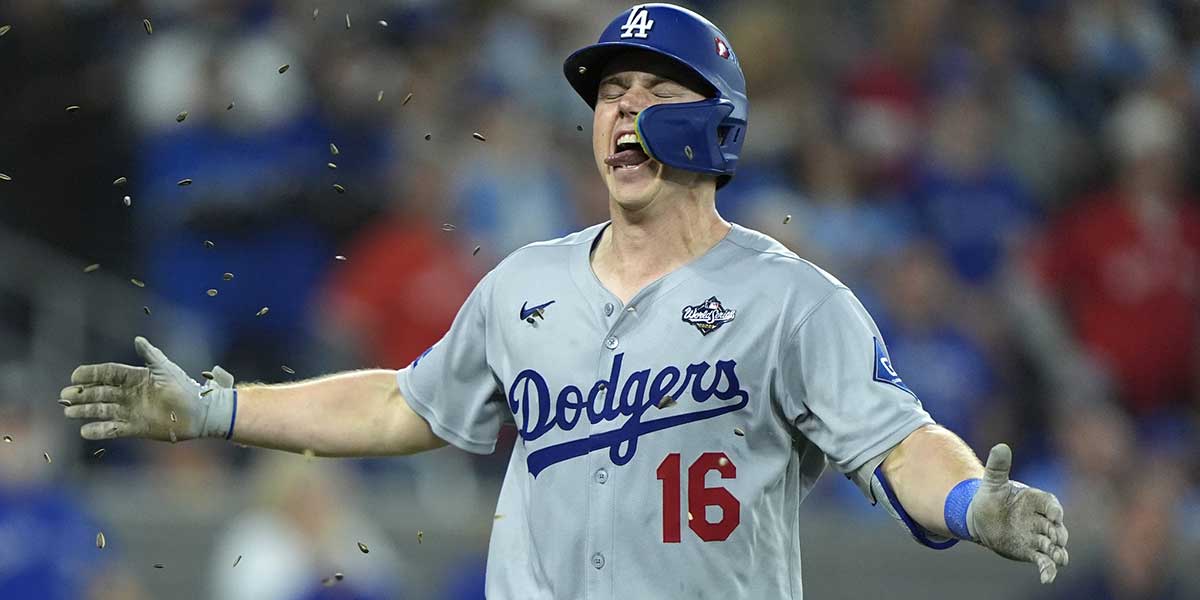 Los Angeles Dodgers catcher Will Smith (16) celebrates after hitting a home run against the Toronto Blue Jays in the eleventh inning during game seven of the 2025 MLB World Series at Rogers Centre.