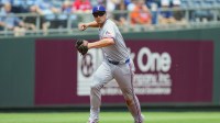 Texas Rangers shortstop Corey Seager (5) throws to first base during the first inning against the Kansas City Royals at Kauffman Stadium.