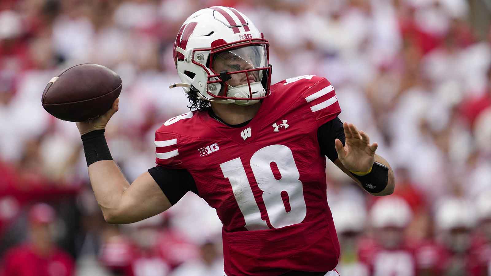 Wisconsin Badgers quarterback Danny O'Neil (18) throws a pass during the second quarter against the Maryland Terrapins at Camp Randall Stadium.