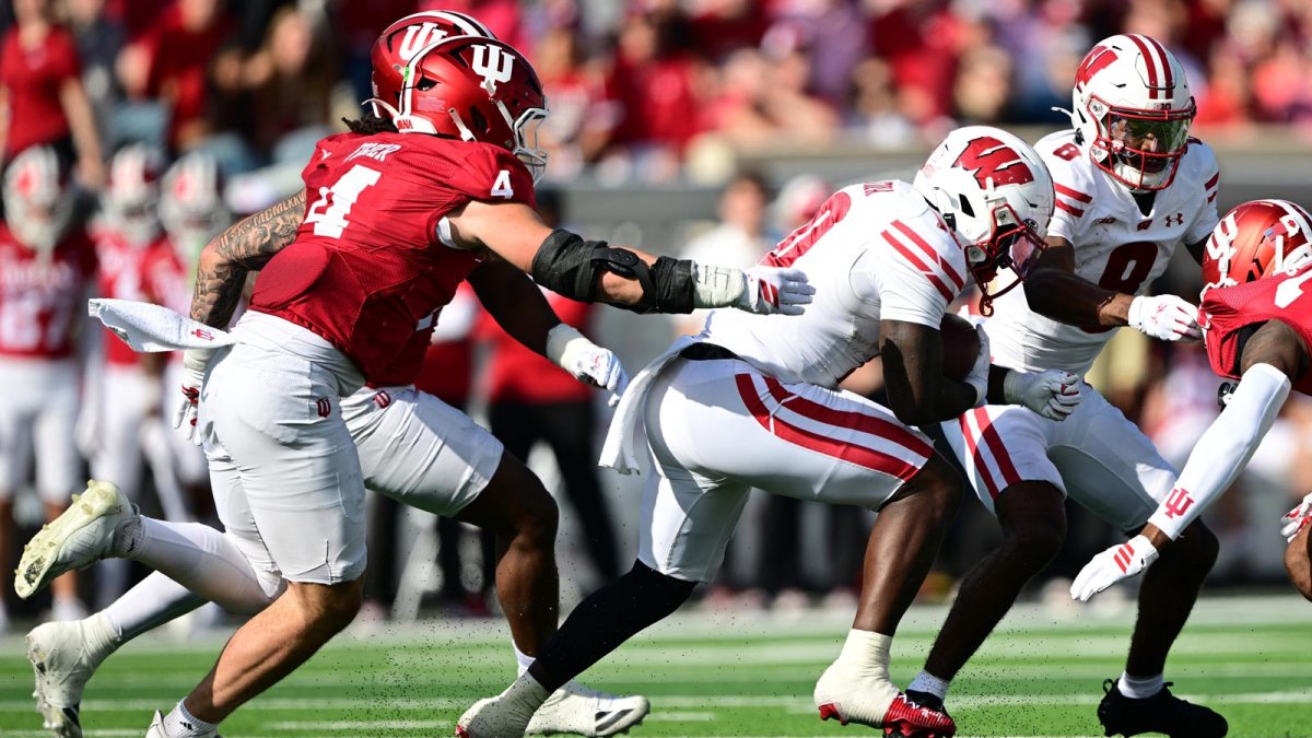 Wisconsin Badgers running back Gideon Ituka (10) runs the ball past Indiana Hoosiers linebacker Aiden Fisher (4) during the second quarter at Memorial Stadium.