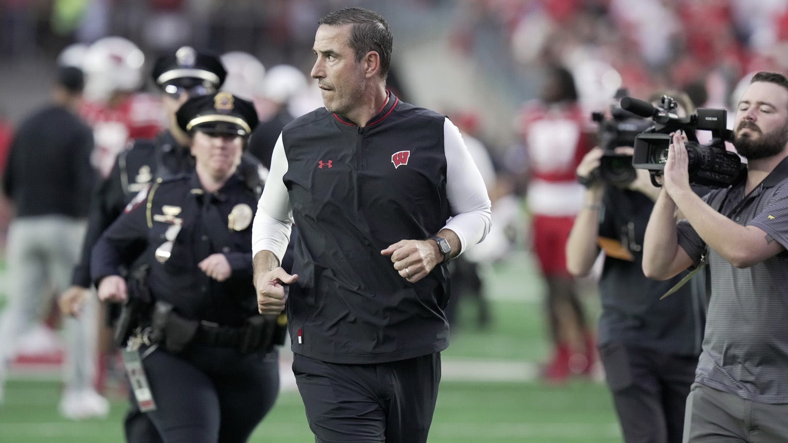 Wisconsin head coach Luke Fickell runs off the field after their 34-0 loss to Ohio State at Camp Randall Stadium.