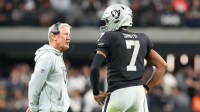 Las Vegas Raiders quarterback Geno Smith (7) talks to head coach Pete Carroll in game against the Cleveland Browns during the fourth quarter at Allegiant Stadium. Mandatory Credit: Stephen R. Sylvanie-Imagn Images