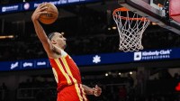 Atlanta Hawks forward Zaccharie Risacher (10) goes in for a dunk against the Los Angeles Lakers during the second half at State Farm Arena.