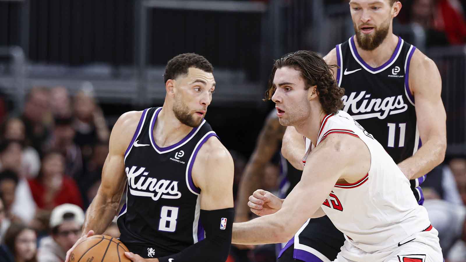 Chicago Bulls guard Josh Giddey (3) defends against Sacramento Kings guard Zach LaVine (8) during the first half at United Center.