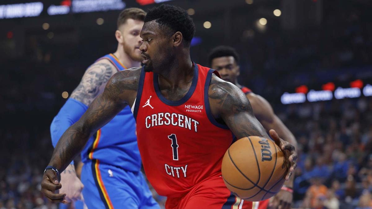 New Orleans Pelicans forward Zion Williamson (1) moves the ball around Oklahoma City Thunder center Isaiah Hartenstein (55) after a rebound during the first quarter at Paycom Center.