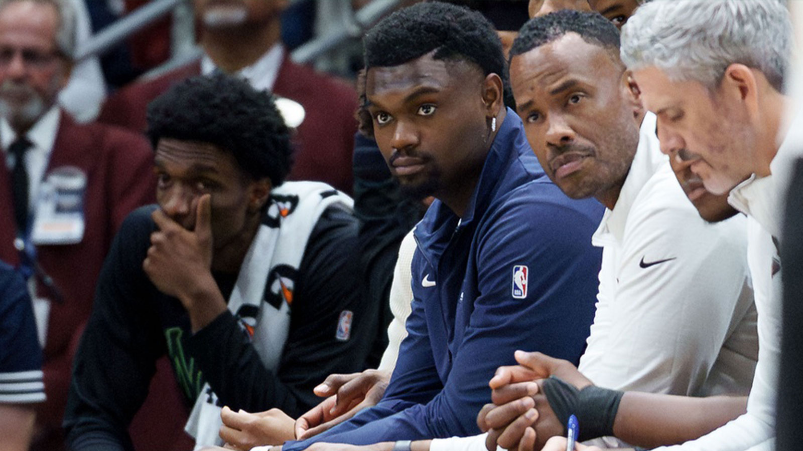 New Orleans Pelicans forward Zion Williamson, center, looks from the bench against the Golden State Warriors during the second half at Smoothie King Center.