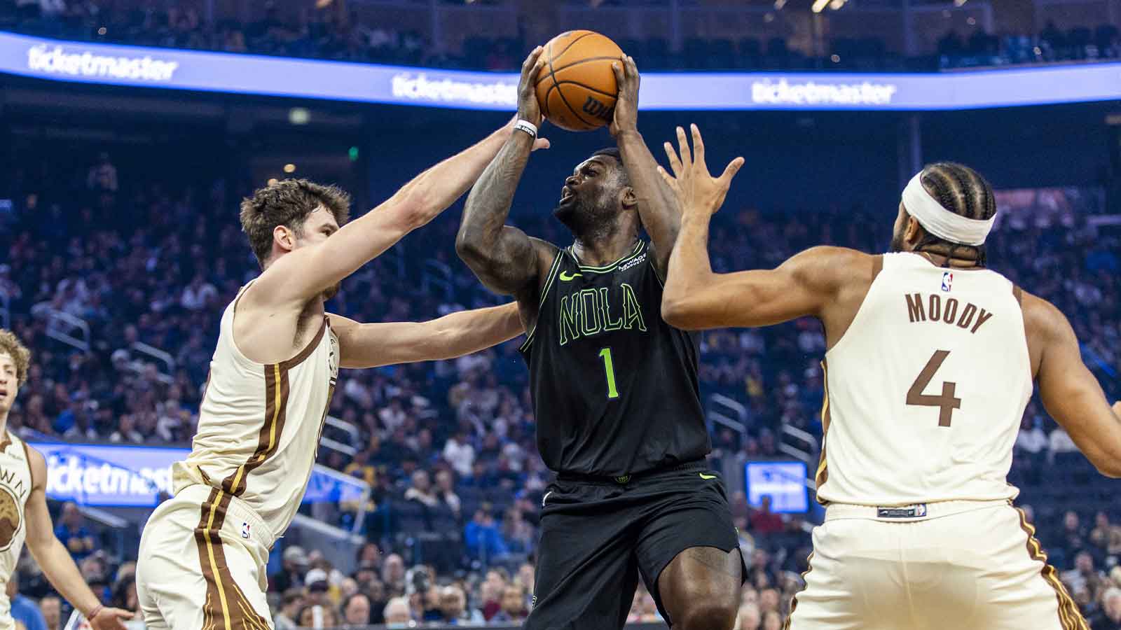 Golden State Warriors center Quinten Post (21) and guard Moses Moody (4) defend New Orleans Pelicans forward Zion Williamson (1) during the first quarter at Chase Center.
