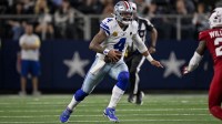 Dallas Cowboys quarterback Dak Prescott (4) runs with the ball during the game between the Dallas Cowboys and the Arizona Cardinals at AT&T Stadium.