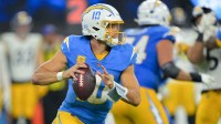Los Angeles Chargers quarterback Justin Herbert (10) looks to pass the ball against the Pittsburgh Steelers during the fourth quarter of the game at SoFi Stadium.
