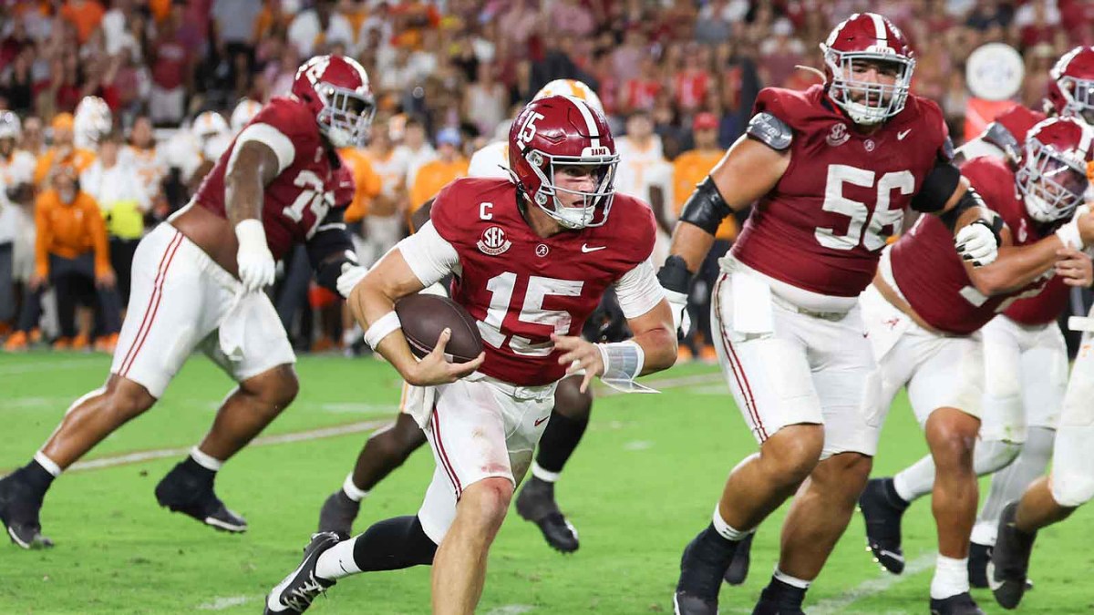 Alabama Crimson Tide quarterback Ty Simpson (15) runs with the ball during the fourth quarter against the Tennessee Volunteers at Saban Field at Bryant-Denny Stadium.