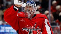 Washington Capitals goaltender Charlie Lindgren (79) squirts his face with water during a timeout against the Los Angeles Kings during the second period at Capital One Arena.