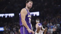 Los Angeles Lakers guard Luka Doncic reacts to a fan during the second quarter of a game against the Oklahoma City Thunder at Paycom Center.