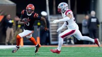 Cincinnati Bengals wide receiver Tee Higgins (5) runs with a catch in the fourth quarter of the NFL Week 12 game between the Cincinnati Bengals and the New England Patriots at Paycor Stadium in downtown Cincinnati on Sunday, Nov. 23, 2025. The Bengals fall to 3-8 with a 26-20 loss at home.