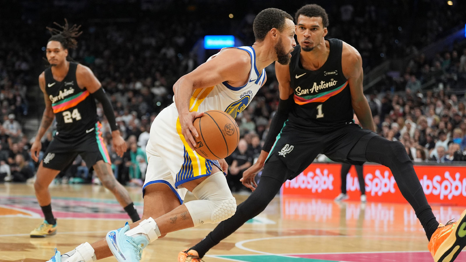Golden State Warriors guard Stephen Curry (30) dribbles against San Antonio Spurs forward Victor Wembanyama (1) in the second half at Frost Bank Center. 