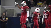 Arizona Cardinals linebacker Josh Sweat (10) celebrates after sacking Dallas Cowboys quarterback Dak Prescott (4) in the second half at AT&T Stadium.