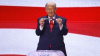 United States president Donald Trump holds up the country name} during the FIFA World Cup 2026 Final Draw at John F. Kennedy Center for the Performing Arts.