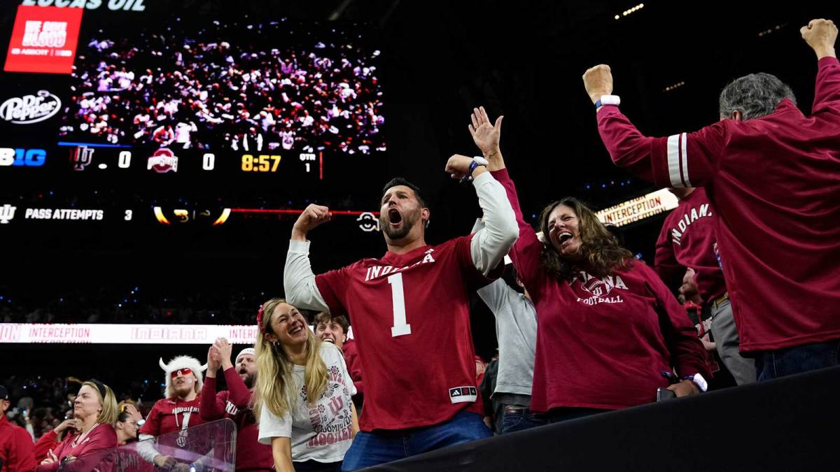 Indiana Hoosiers fans celebrate during the Big Ten Conference championship game against the Ohio State Buckeyes at Lucas Oil Stadium in Indianapolis on Dec. 6, 2025. Ohio State lost 13-10.