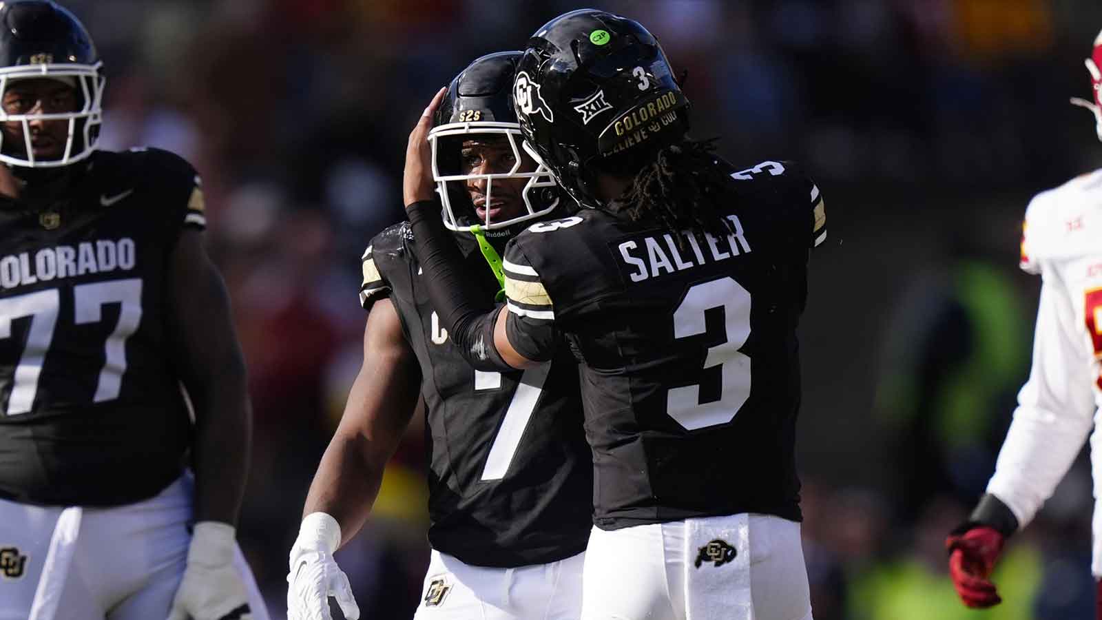 Colorado Buffaloes running back Dallan Hayden (7) and quarterback Kaidon Salter (3) celebrate a first down in the against the Iowa State Cyclones at Folsom Field.