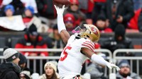 San Francisco 49ers wide receiver Jauan Jennings (15) warms up before the game against the Cleveland Browns at Huntington Bank Field.