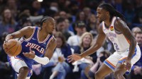 76ers guard Tyrese Maxey (0) drives against Oklahoma City Thunder guard Cason Wallace (22) during the second half at Paycom Center