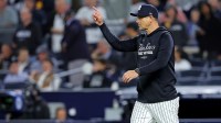 New York Yankees manager Aaron Boone signals to the bullpen during the seventh inning against the Toronto Blue Jays during game four of the ALDS round for the 2025 MLB playoffs at Yankee Stadium.