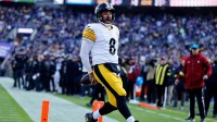 Pittsburgh Steelers quarterback Aaron Rodgers (8) reacts after scoring a touchdown against the Baltimore Ravens during the first half at M&T Bank Stadium.