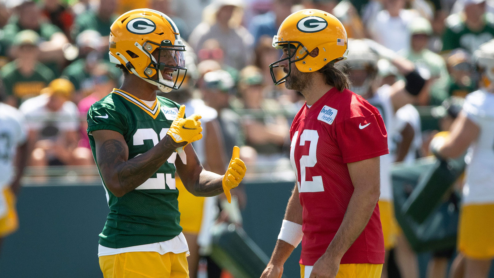 Green Bay Packers cornerback Rasul Douglas (29) speaks with quarterback Aaron Rodgers (12) during Packers training camp on Thursday, July 28, 2022, at Ray Nitschke Field in Ashwaubenon, Wisconsin.