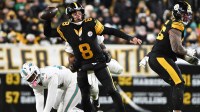 Pittsburgh Steelers quarterback Aaron Rodgers (8) looks to throw in the first quarter against the Miami Dolphins at Acrisure Stadium.