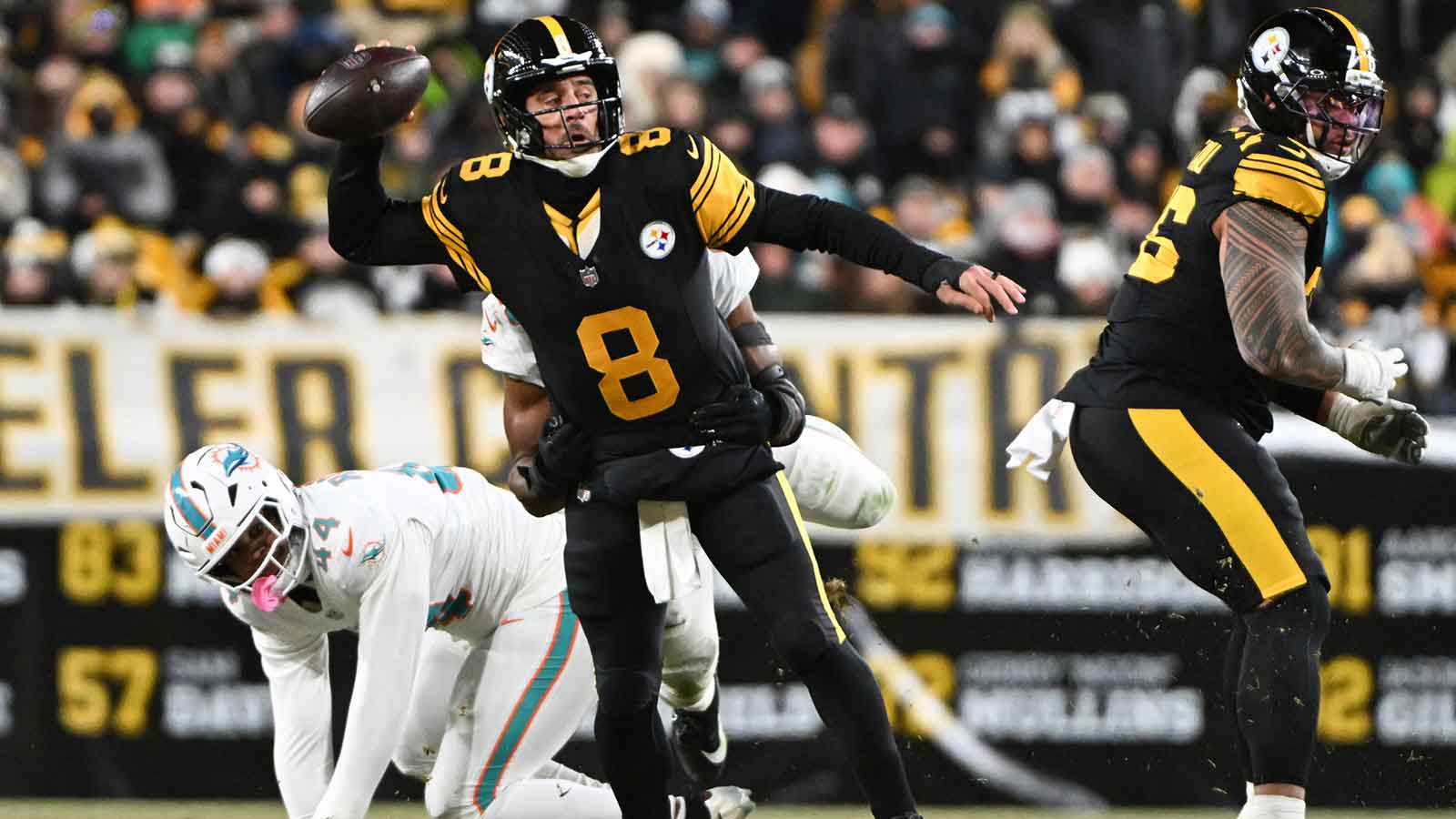 Pittsburgh Steelers quarterback Aaron Rodgers (8) looks to throw in the first quarter against the Miami Dolphins at Acrisure Stadium.