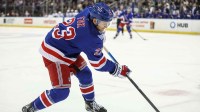 New York Rangers defenseman Adam Fox (23) controls the puck in the second period against the Tampa Bay Lightning at Madison Square Garden.