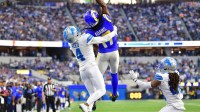 Los Angeles Rams wide receiver Davante Adams (17) goes up for a pass against Detroit Lions cornerback D.J. Reed (4) during the second quarter at SoFi Stadium.