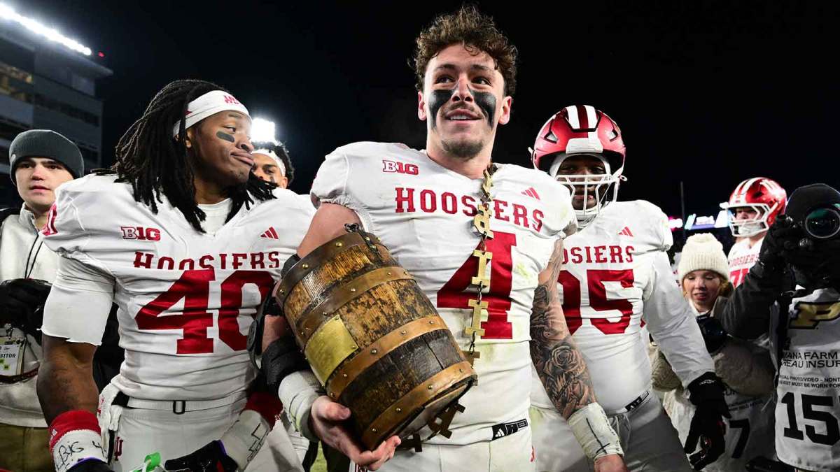 West Lafayette, Indiana, USA; Indiana Hoosiers linebacker Aiden Fisher (4) holds the Old Oaken Bucket trophy after the game against the Purdue Boilermakers at Ross-Ade Stadium.